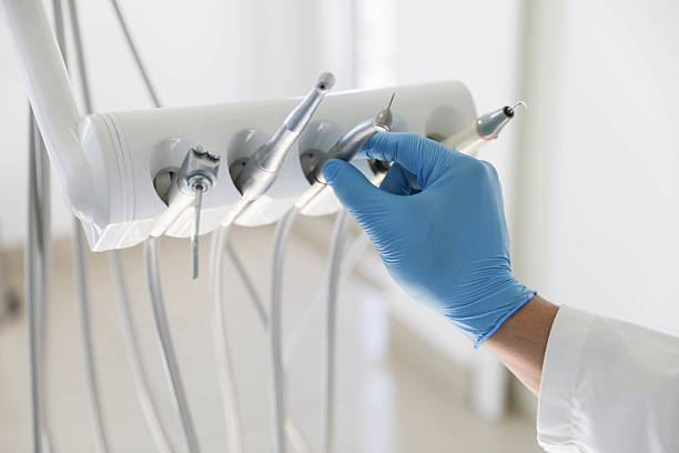 Professional Tooth Extraction technician working in Charlottesville, VA